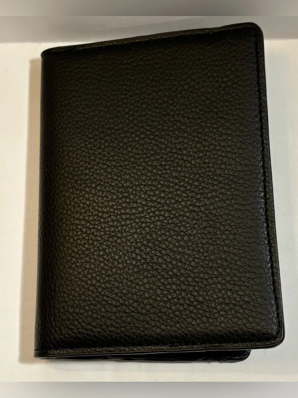 Open Story black pebble leather passport holder or travel wallet